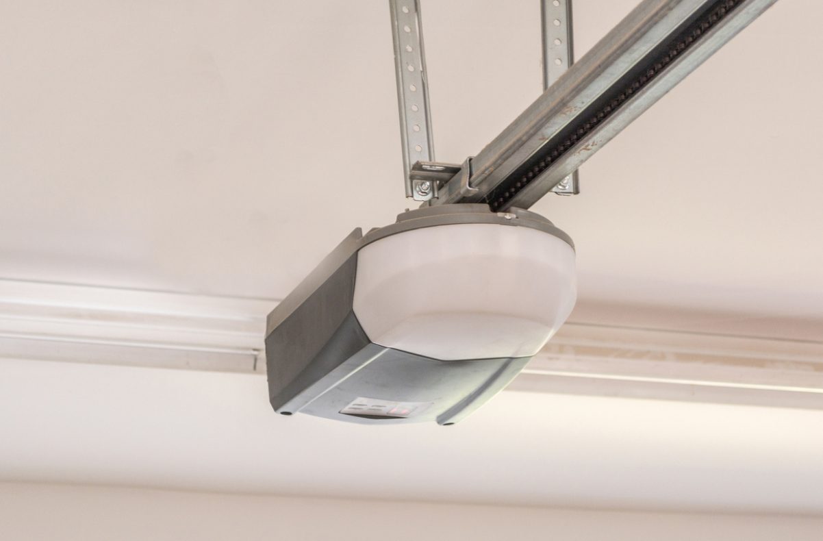 Automatic Garage Door Opener Motor on the Ceiling. Close Up. Automatic Garage Door Opener Motor on the Ceiling. Close Up